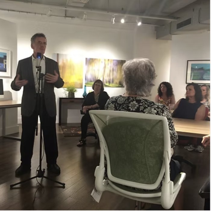 The artist addressing guests at a New York exhibition
