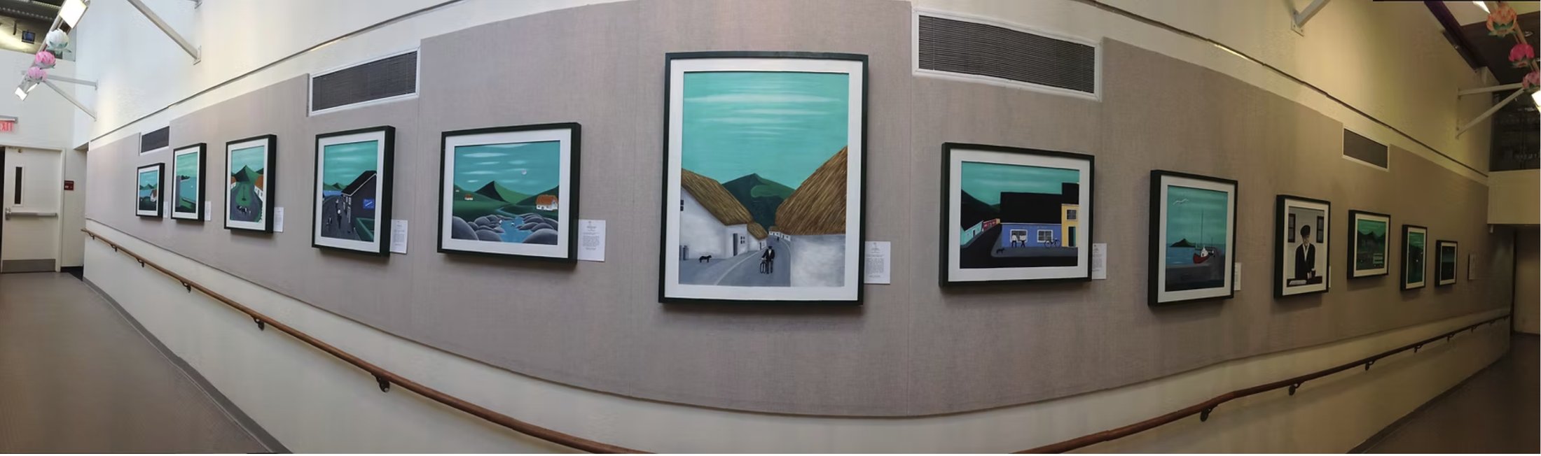 Panoramic view of the Images of Ireland collection hanging in a New York exhibition